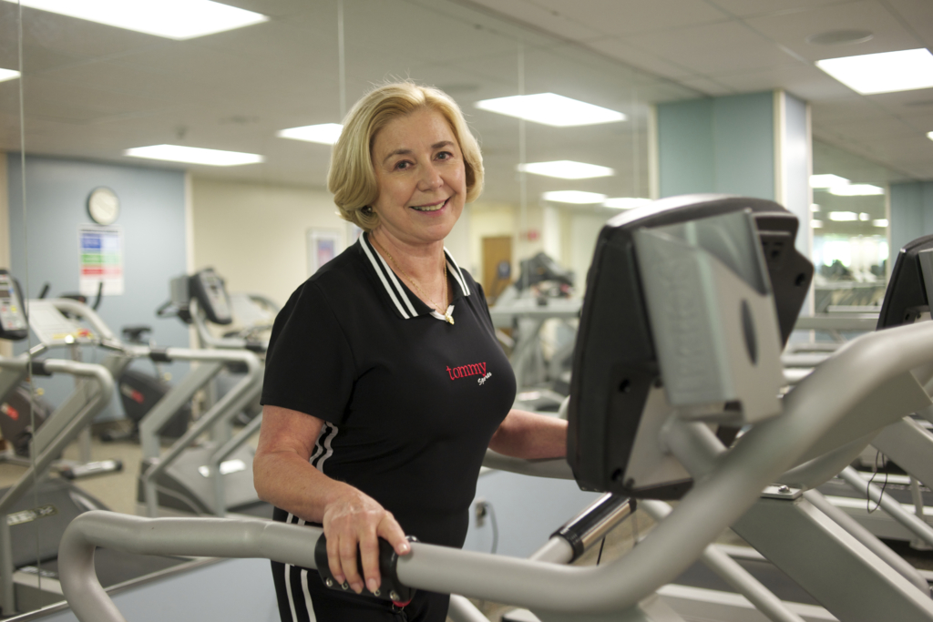Woman on treadmill in cardiac rehab center