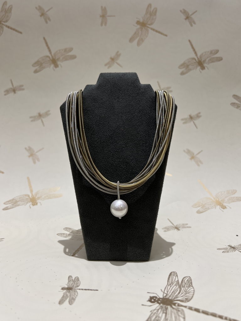 multi-chain necklace with pearl pendant