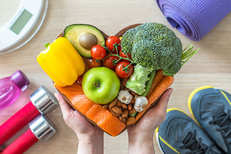 healthy fruits and vegetables in a heart shape plate